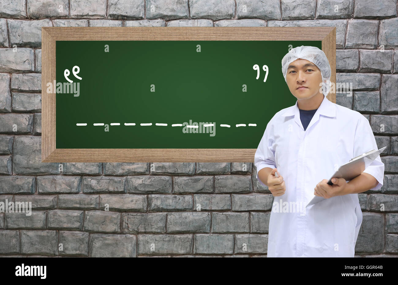 A man in white great coat uniform and black board with space to add text for Concept design Business. Stock Photo