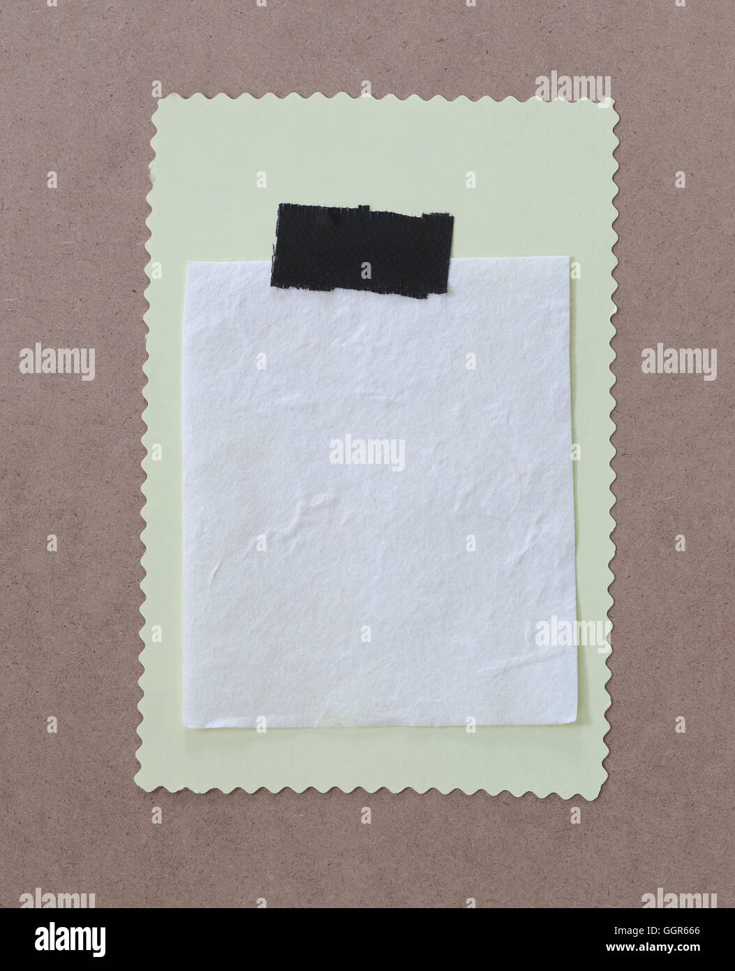 Paper note is empty space on brown wooden for design background and you can input text to it. Stock Photo