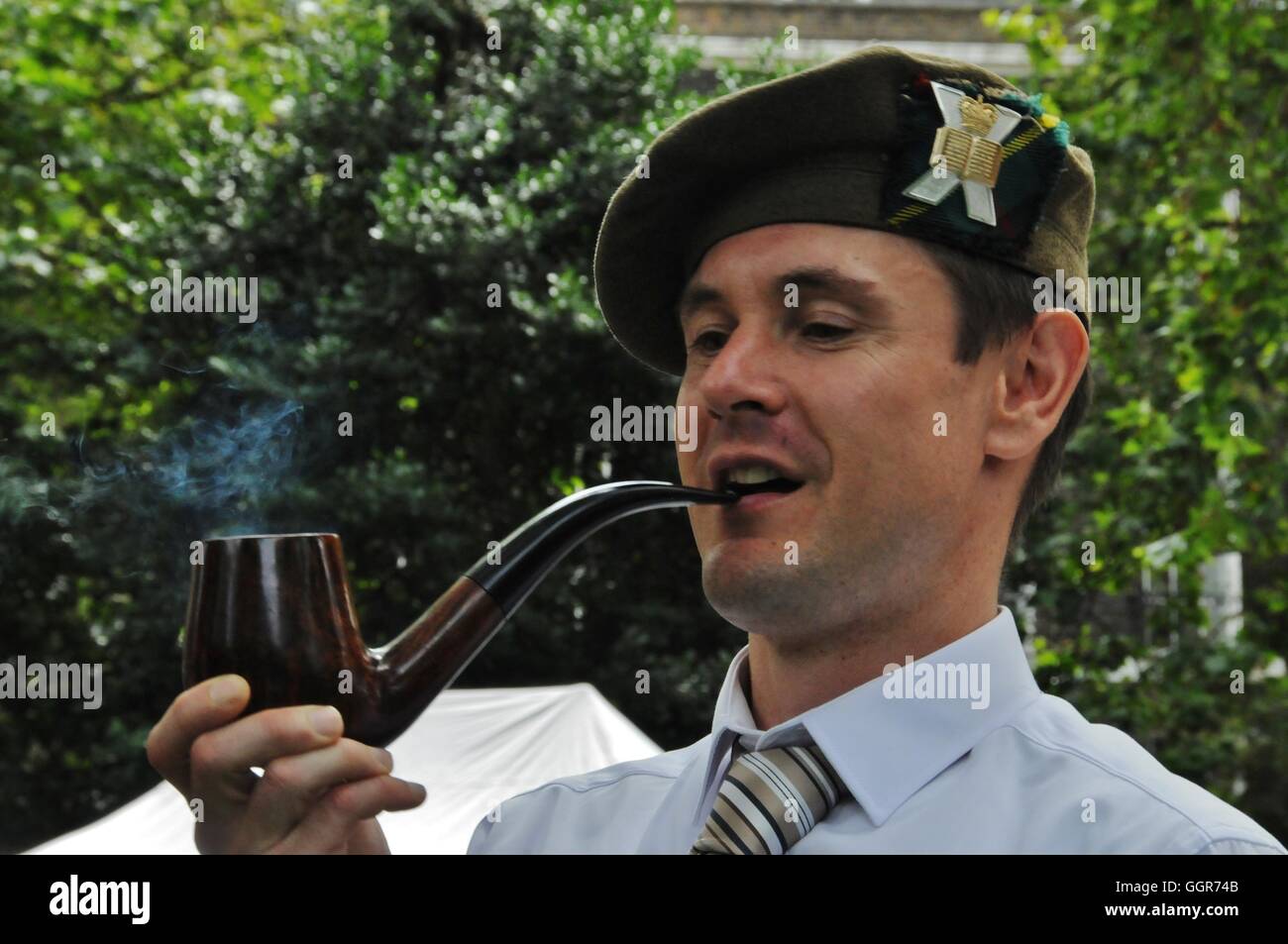 Smoking the pipe, at the start of the 2016 Chap Olympiad. Stock Photo