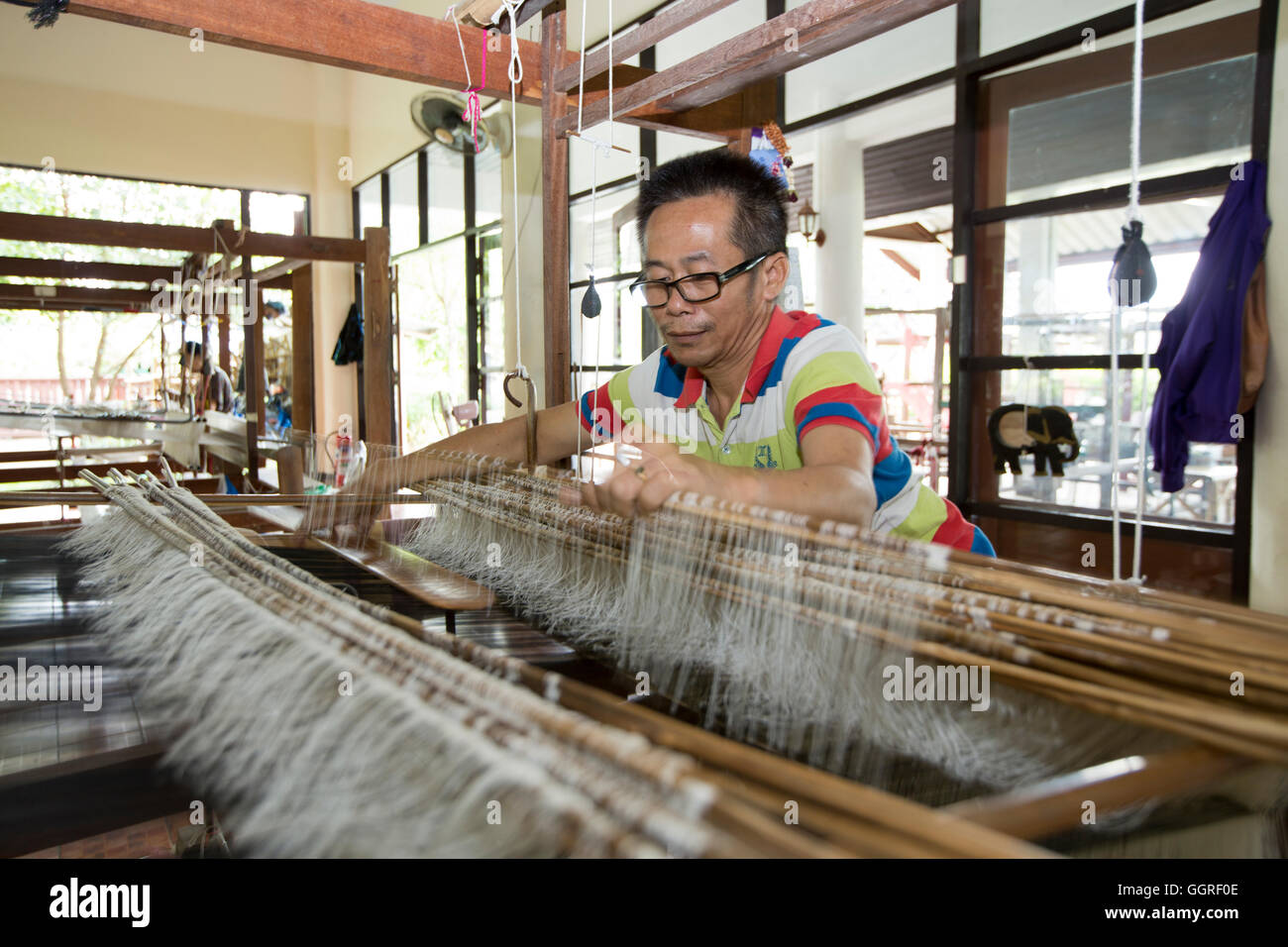 Thai silk weaver in Lamphun Stock Photo