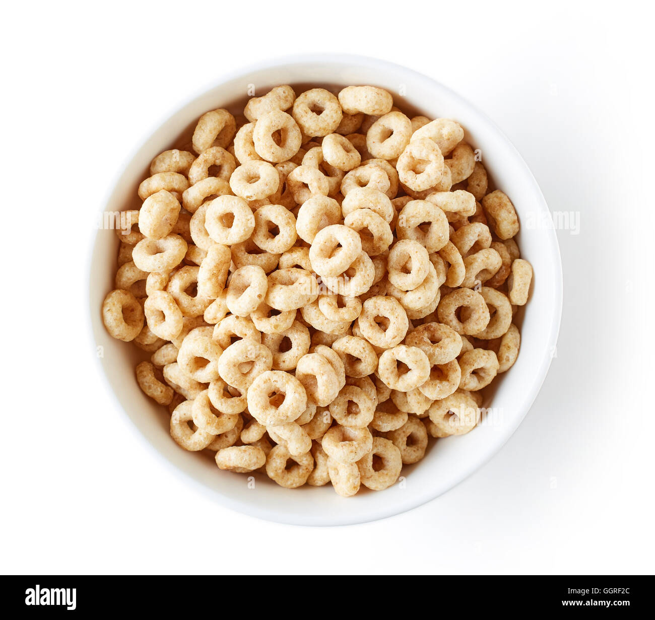 Bowl of Whole Grain Cheerios Cereal isolated on white background, top view Stock Photo