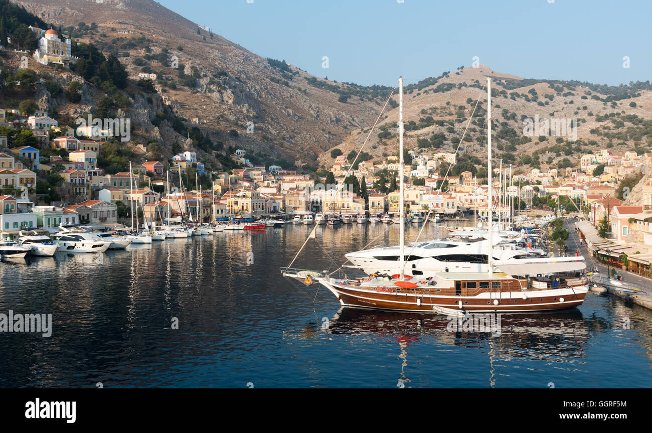 Panoramic image  of Symi town with colorful houses on the hill,  in the Greek  Island of Symi  in Greece Stock Photo