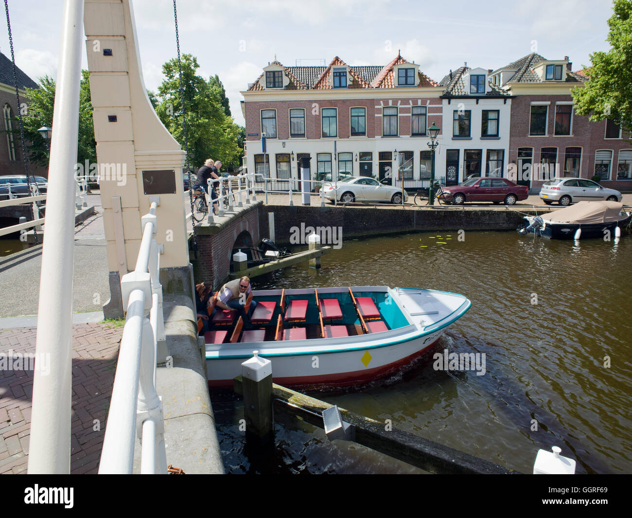Dutch Tourist Boat Passing under low canal bridge Alkmaar Netherlands Stock Photo