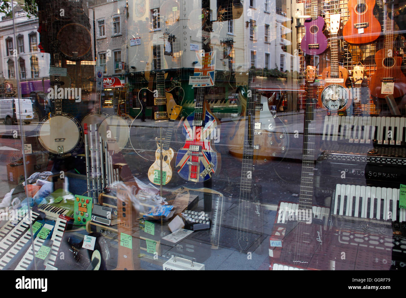Music shop window on Denmark Street in London, where Sixties and Seventies musicians bought their guitars and instruments Stock Photo