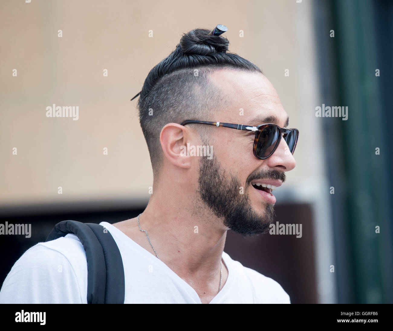 St Tropez fashionista type man male top knot trendy Stock Photo