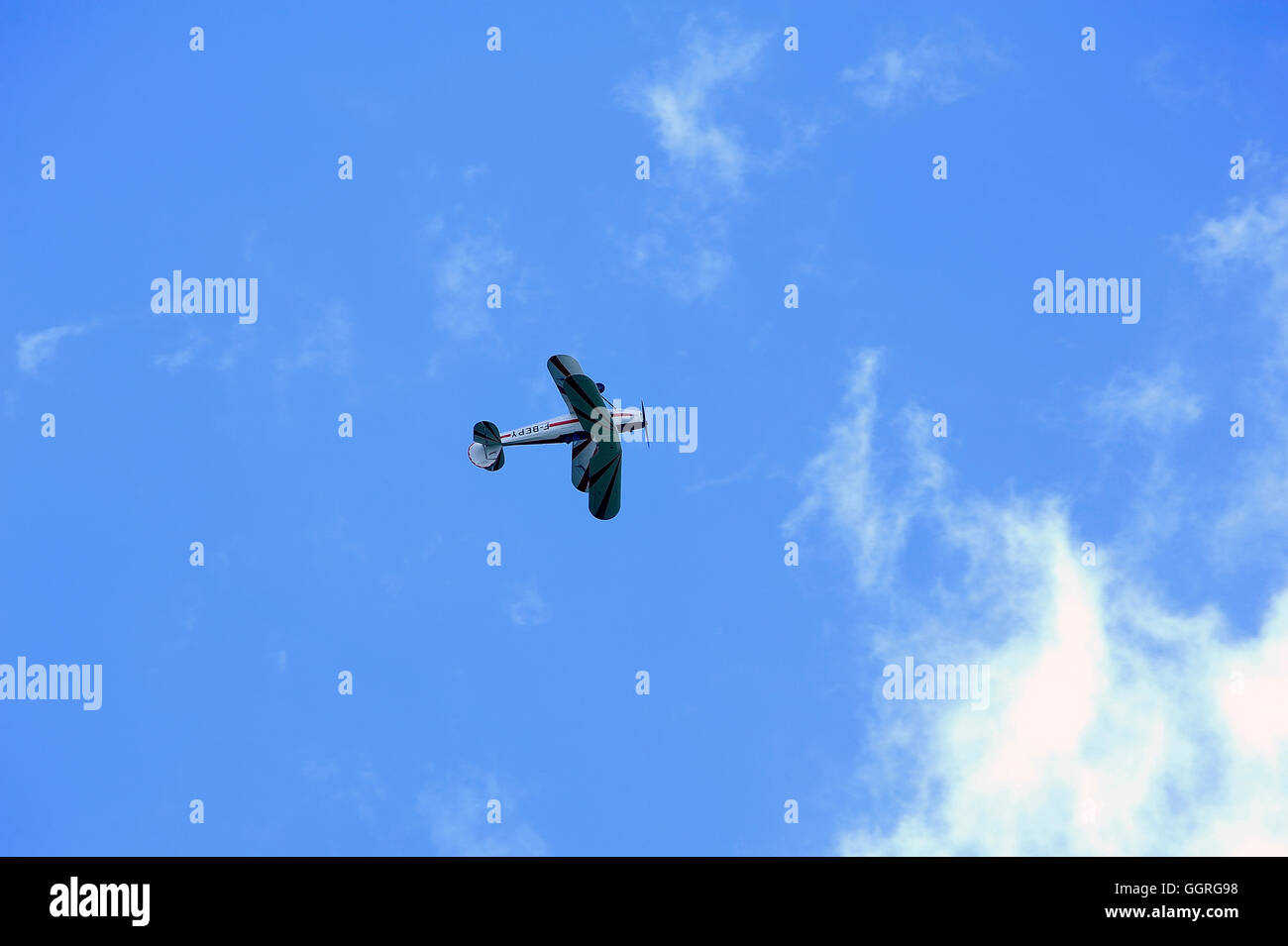 Stampe biplane performing aerobatics in the sky of the Mende airfield in the French department of Gard Stock Photo