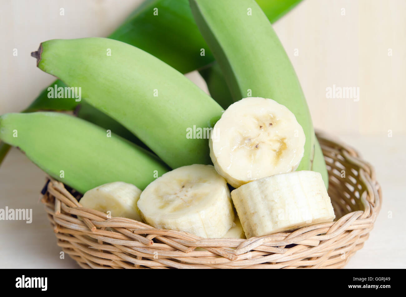 Banana (Other names are Musa banana acuminata, Musa balbisiana, and Musa x paradisiaca) fruit with leaf on basket Stock Photo