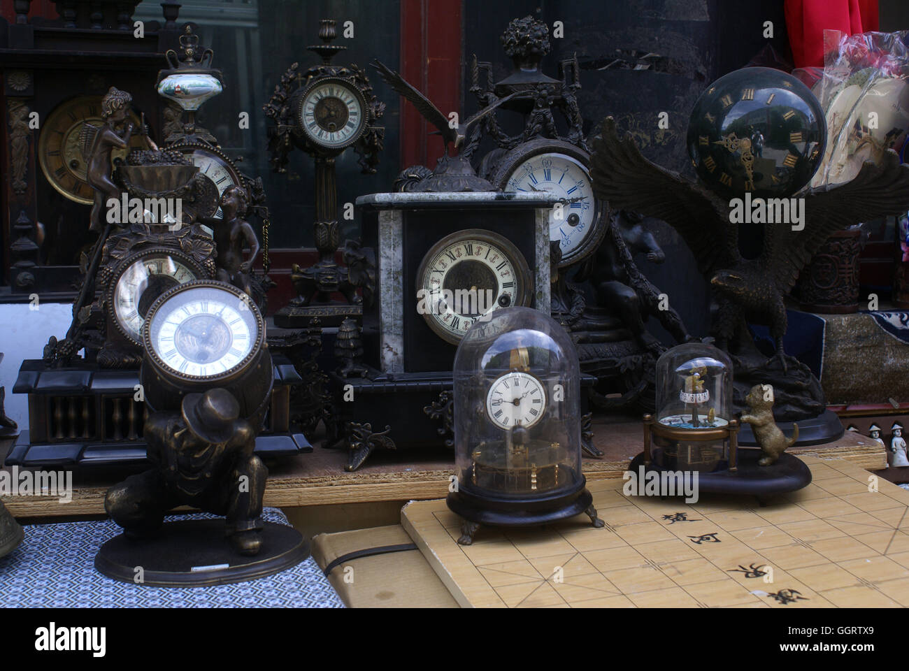 Reproduction antique clocks at the Panjiayuan Flea Market. Beijing - China. Stock Photo