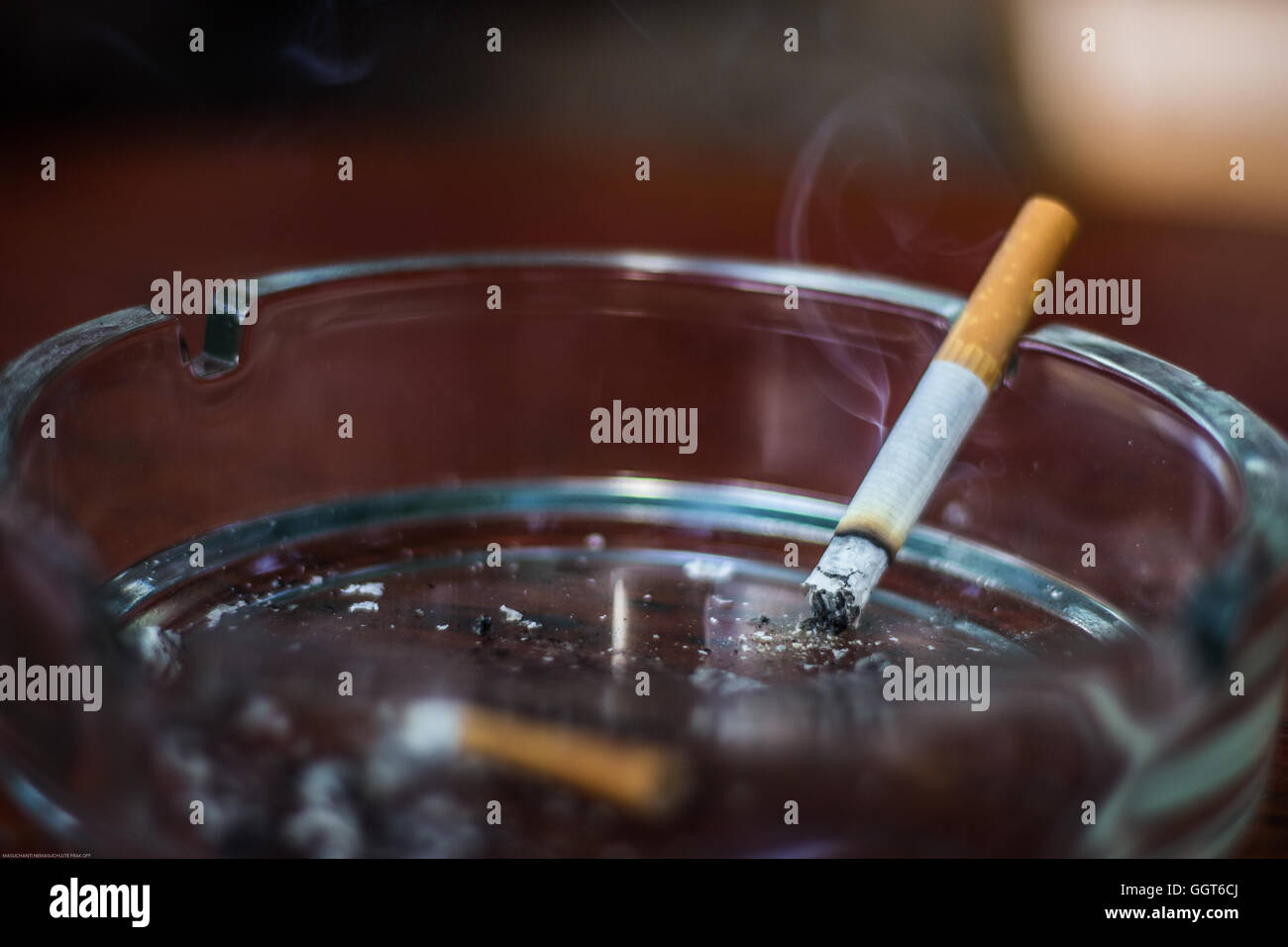 Burning cigarette in an ashtray hires stock photography and images Alamy