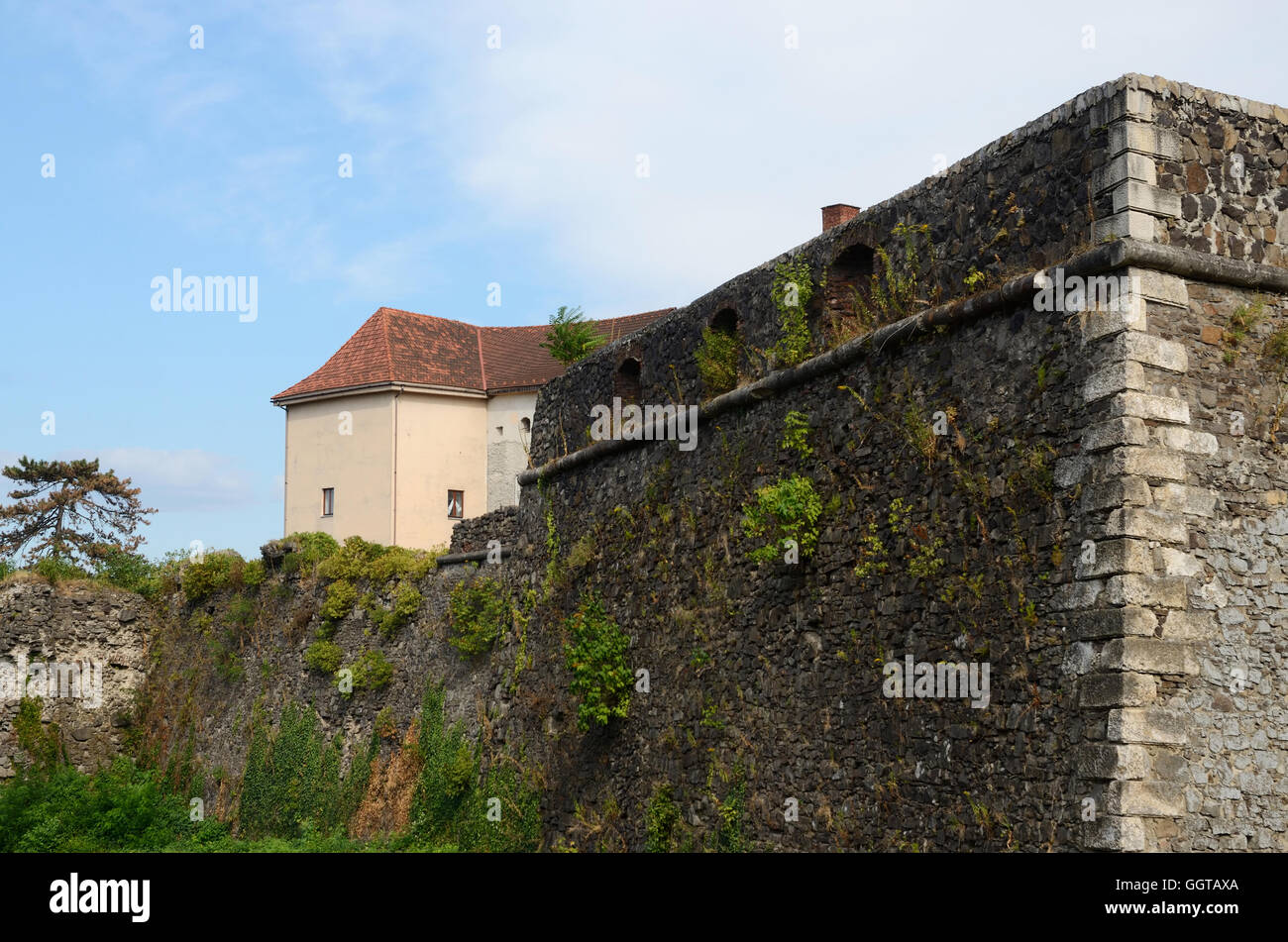 fortified wall and tower of medieval Uzhhorod fortress - extensive citadel on a hill with big moat ,unesco heritage,Western Ukra Stock Photo