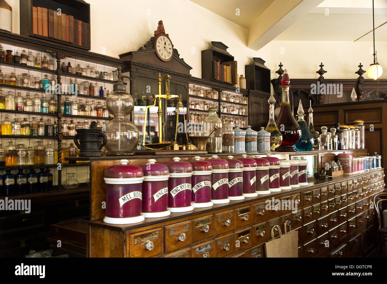 The Pharmacy Shelves - A wonderful display of bottles, potions and unctions in a Victorian pharmacist's shop. Stock Photo