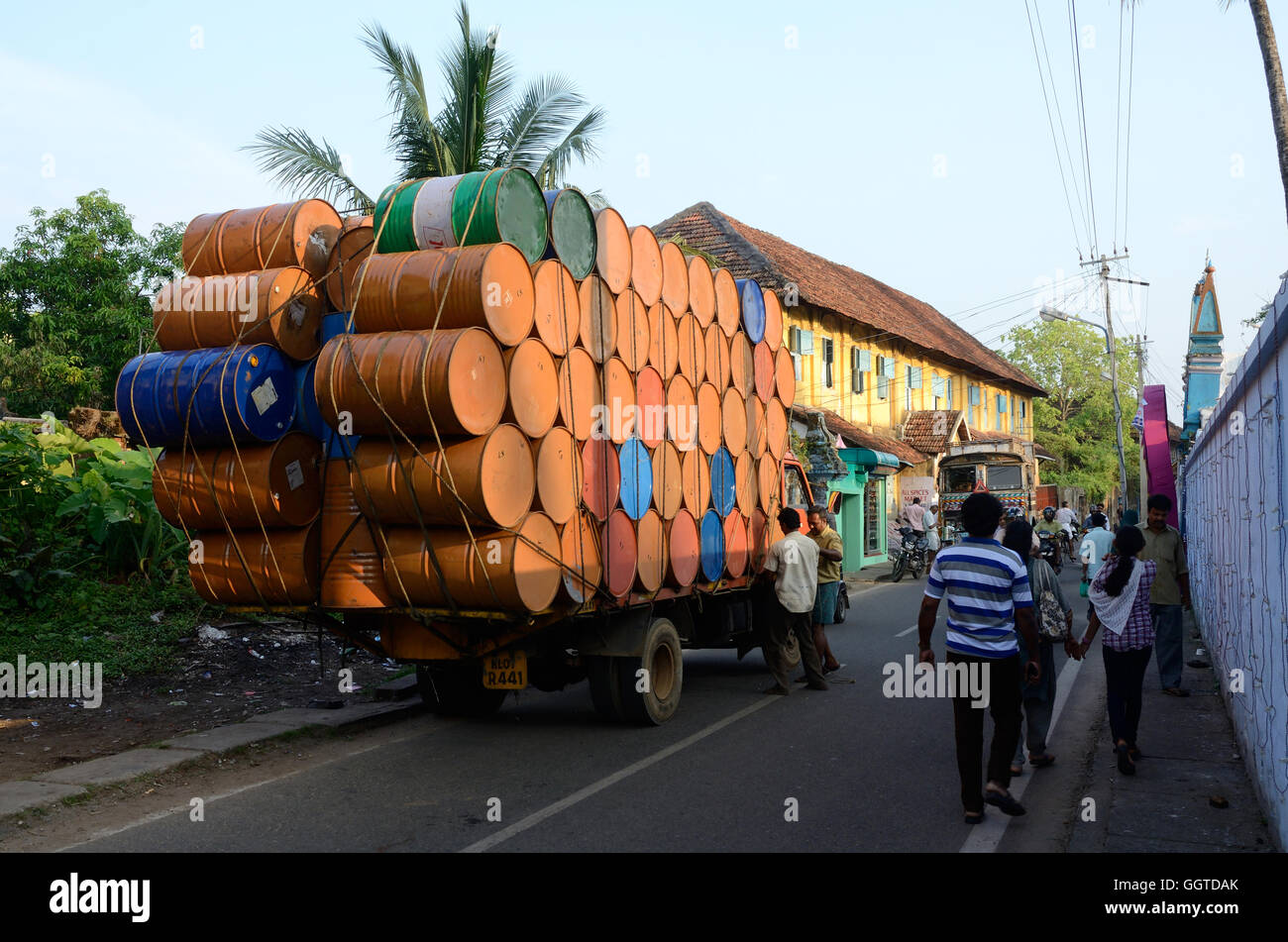 KOCHI, INDIA - DECEMBER 6: unidentified indian drivers preparing heavily overloaded truck for travelling at Kerala state on Dece Stock Photo