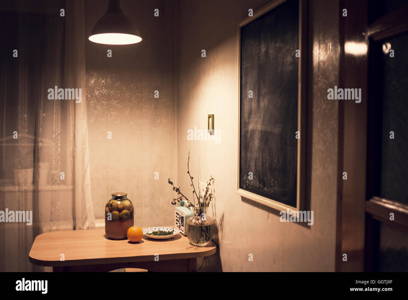 Food on corner table in kitchen with blackboard Stock Photo