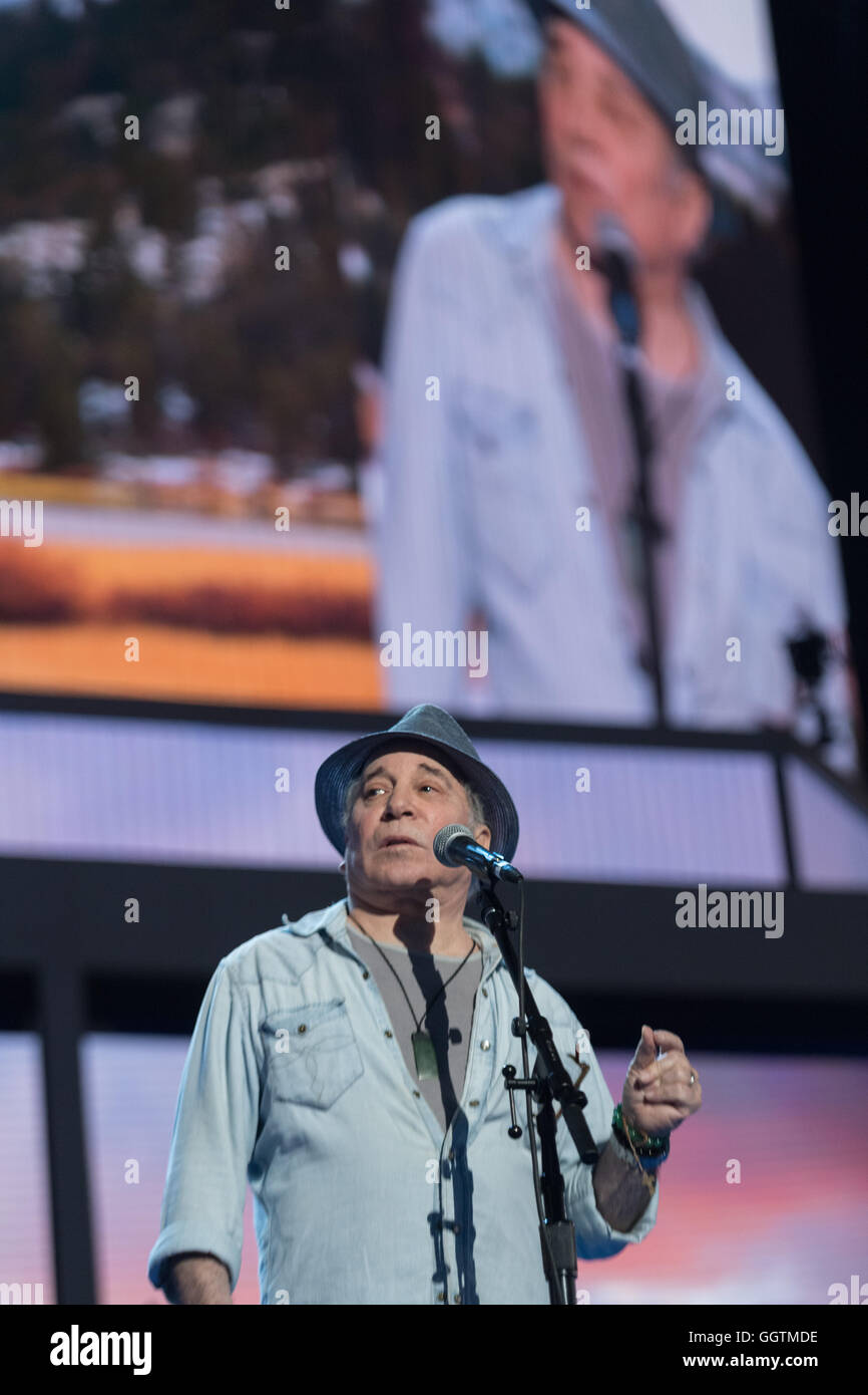 Legendary singer Paul Simon sings during rehearsal preparations for the start of the Democratic National Convention at the Wells Fargo Center July 24, 2016 in Philadelphia, Pennsylvania. Stock Photo