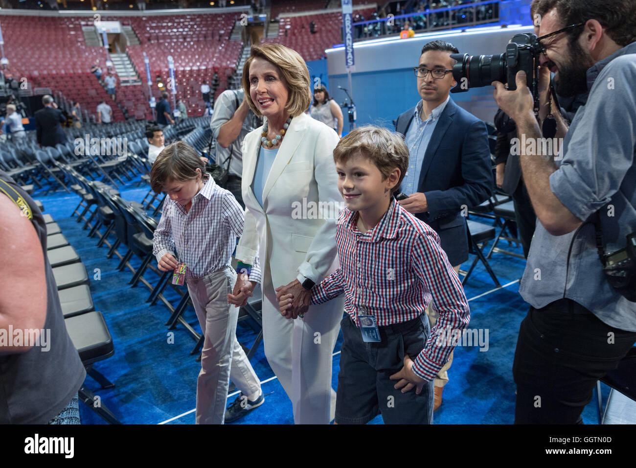 House minority leader Nancy Pelosi walks through the Wells Fargo Arena with her grandchildren a day before the start of the Democratic National Convention July 24, 2016 in Philadelphia, Pennsylvania. Stock Photo