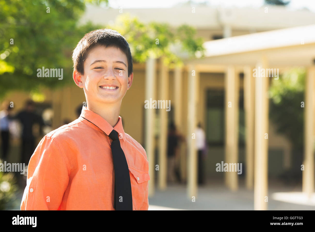 Proud Caucasian boy posing outdoors Stock Photo