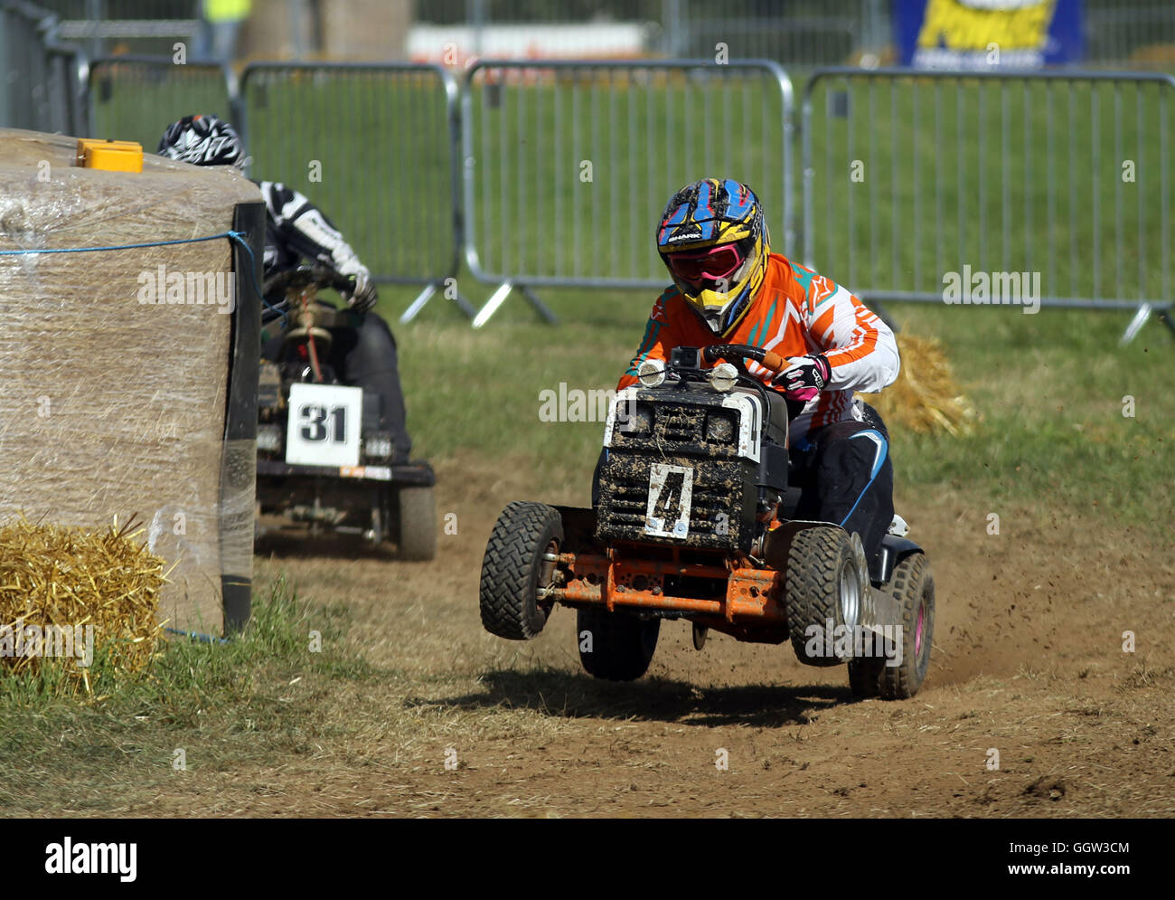 Teams qualify ahead of the 12 hour lawn mower race - which commences at 8pm - at Five Oaks, West Sussex. Stock Photo