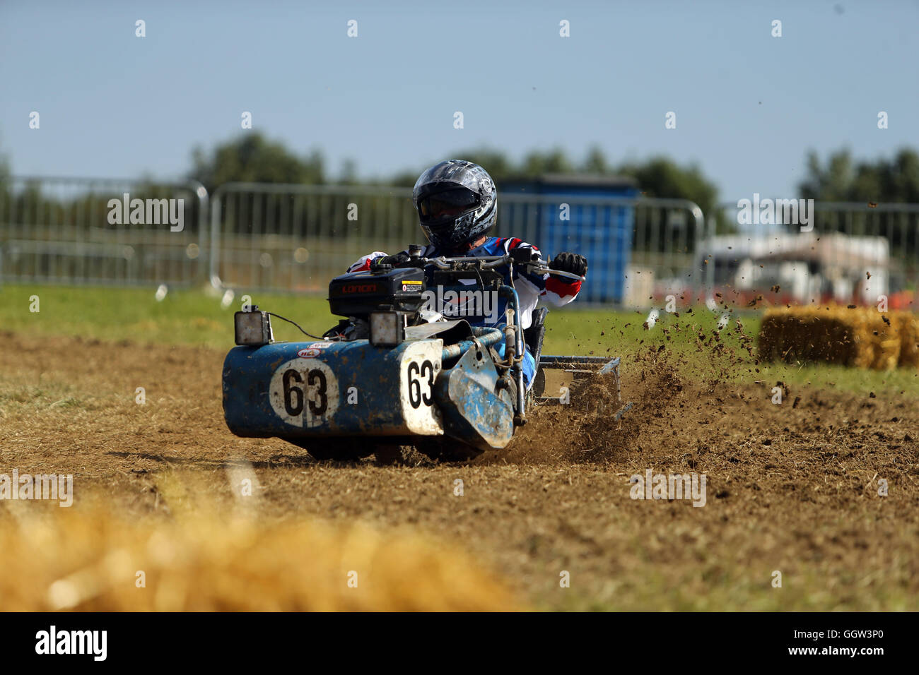 Teams qualify ahead of the 12 hour lawn mower race - which commences at 8pm - at Five Oaks, West Sussex. Stock Photo