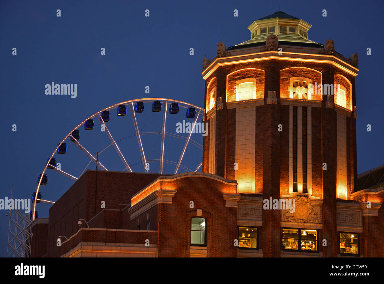 The front towers of Navy Pier  with the ferris wheel in the background are illuminated at night. Stock Photo