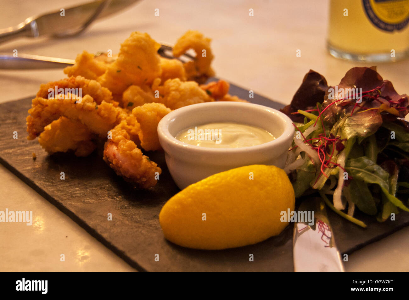 Fish and chips with mayonnaise, lemon and salad Stock Photo