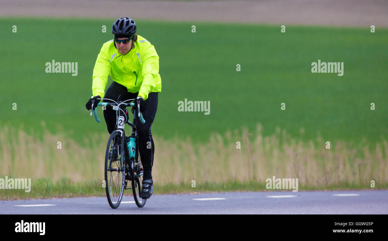 TROSA SWEDEN, May 15, 2016.  Participant in a smaller bike race, (90 km rural road) for both professionals and amateurs. A rainy Stock Photo