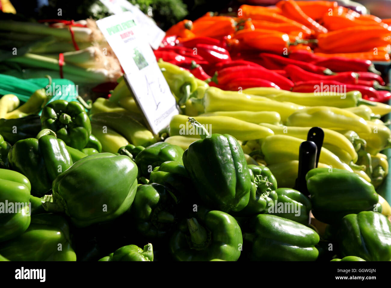 A display of sweet peppers on a mediterranean farm market stall Stock Photo
