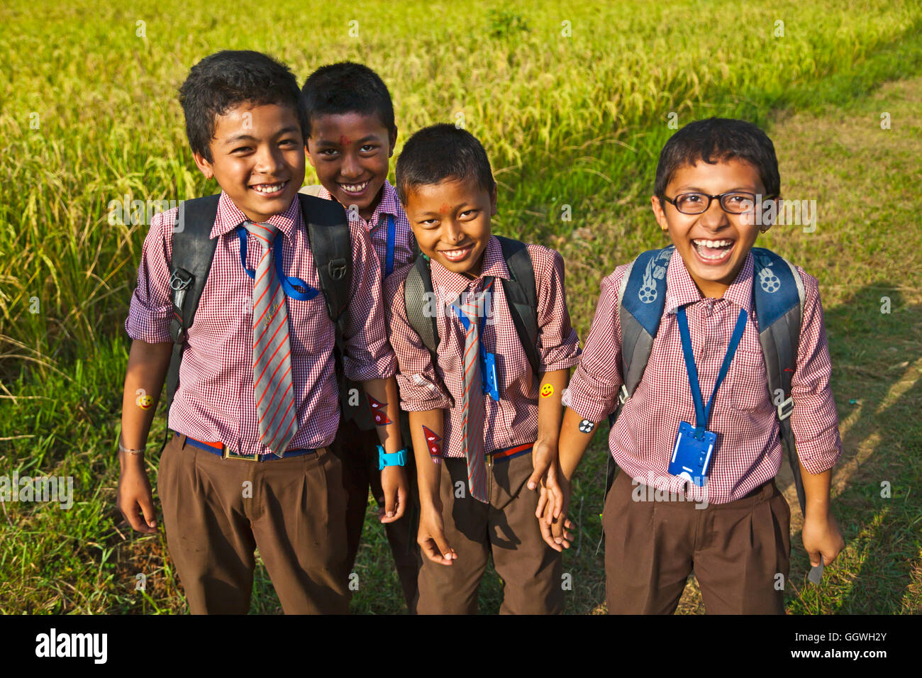 School boys are smiling as they head off to learn - NEPAL Stock Photo