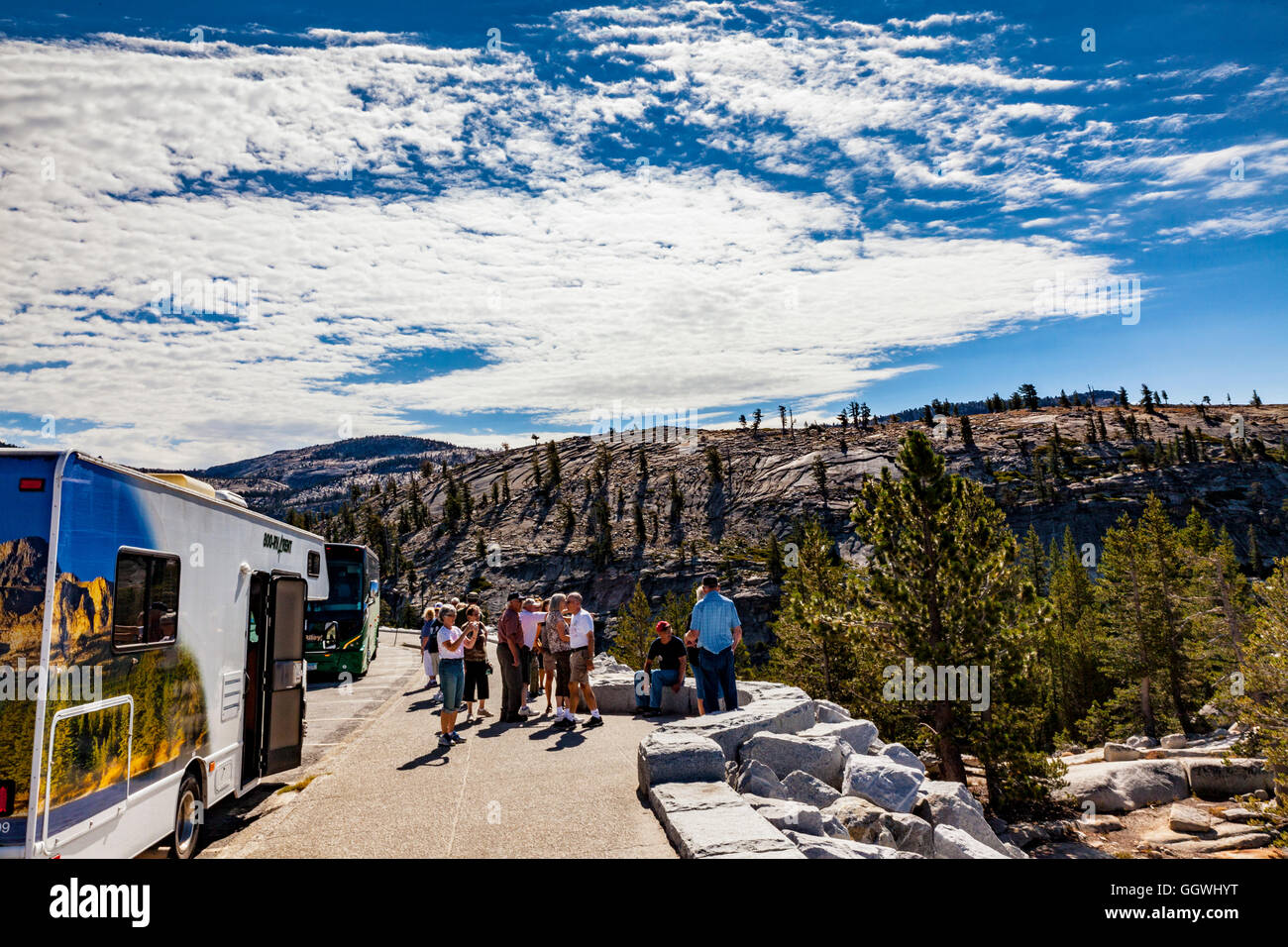 Tourists at Olmstead point along Highway 120 Tioga Pass road in Yosemite National Park California USA Stock Photo