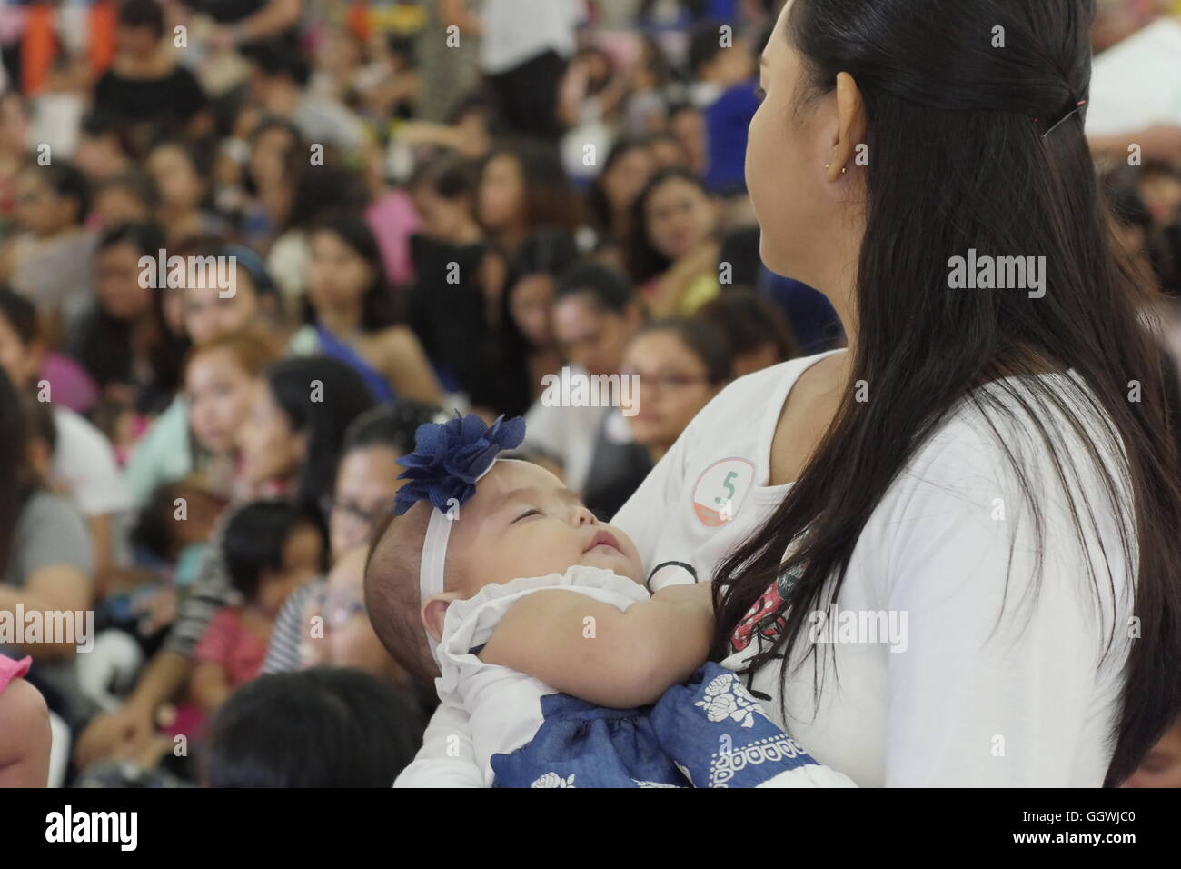 Baby falls asleep after her breastfeeding. To celebrate the National