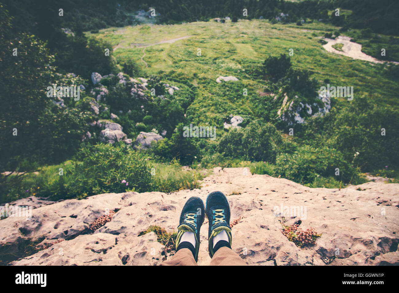 Feet Selfie running shoes Traveler relaxing on cliff mountains outdoor