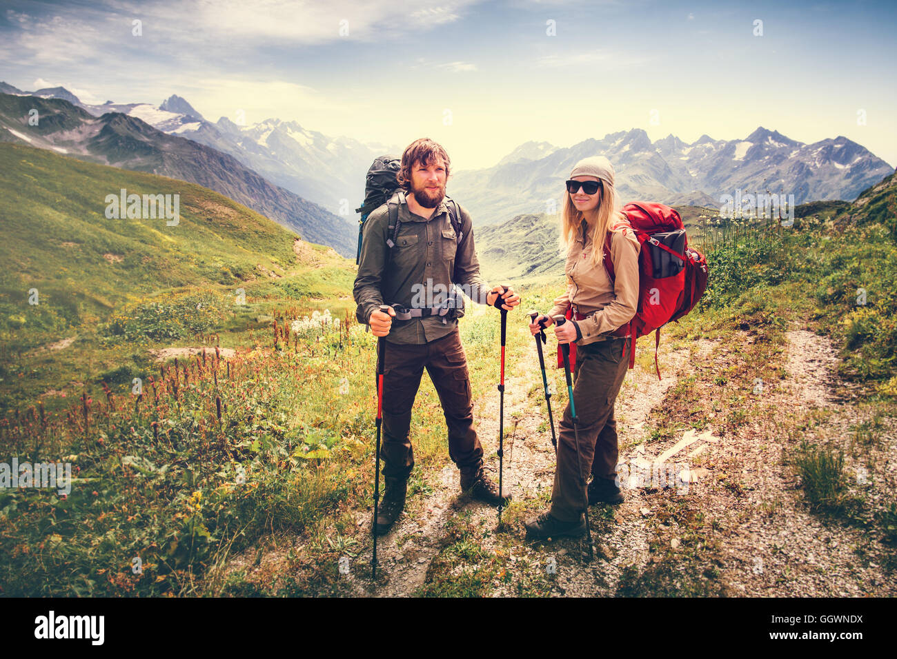 Happy man woman hiking mountains hi-res stock photography and images ...