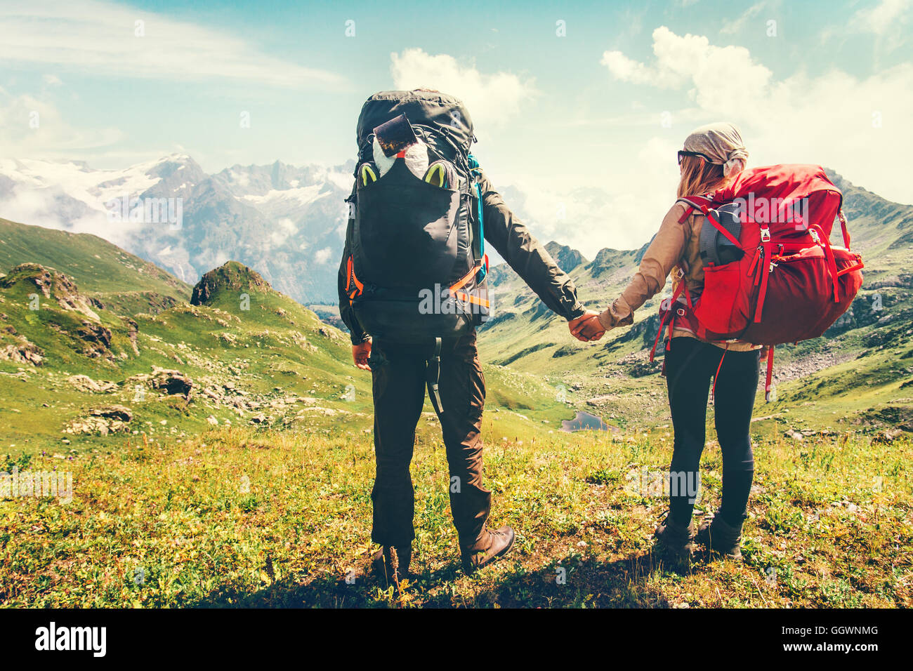 Happy man woman hiking mountains hi-res stock photography and images ...
