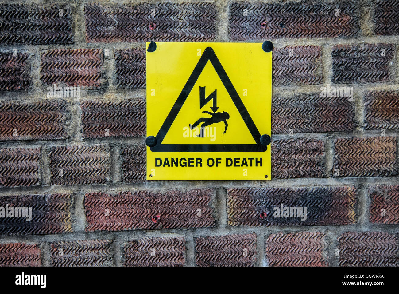 'Danger of Death' sign on brick wall - Berkhamsted, UK Stock Photo
