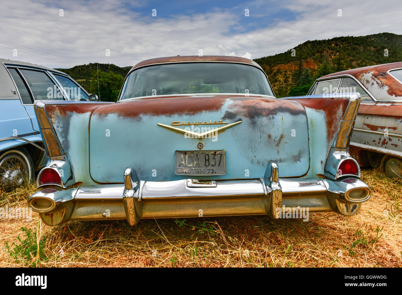 Rusting old car in a desert junk yard Stock Photo - Alamy