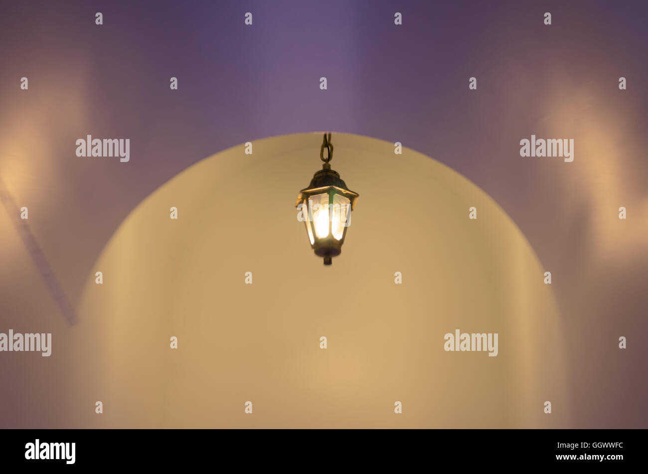 Blurry Background of Light Lamp In The Dark Place. Stock Photo