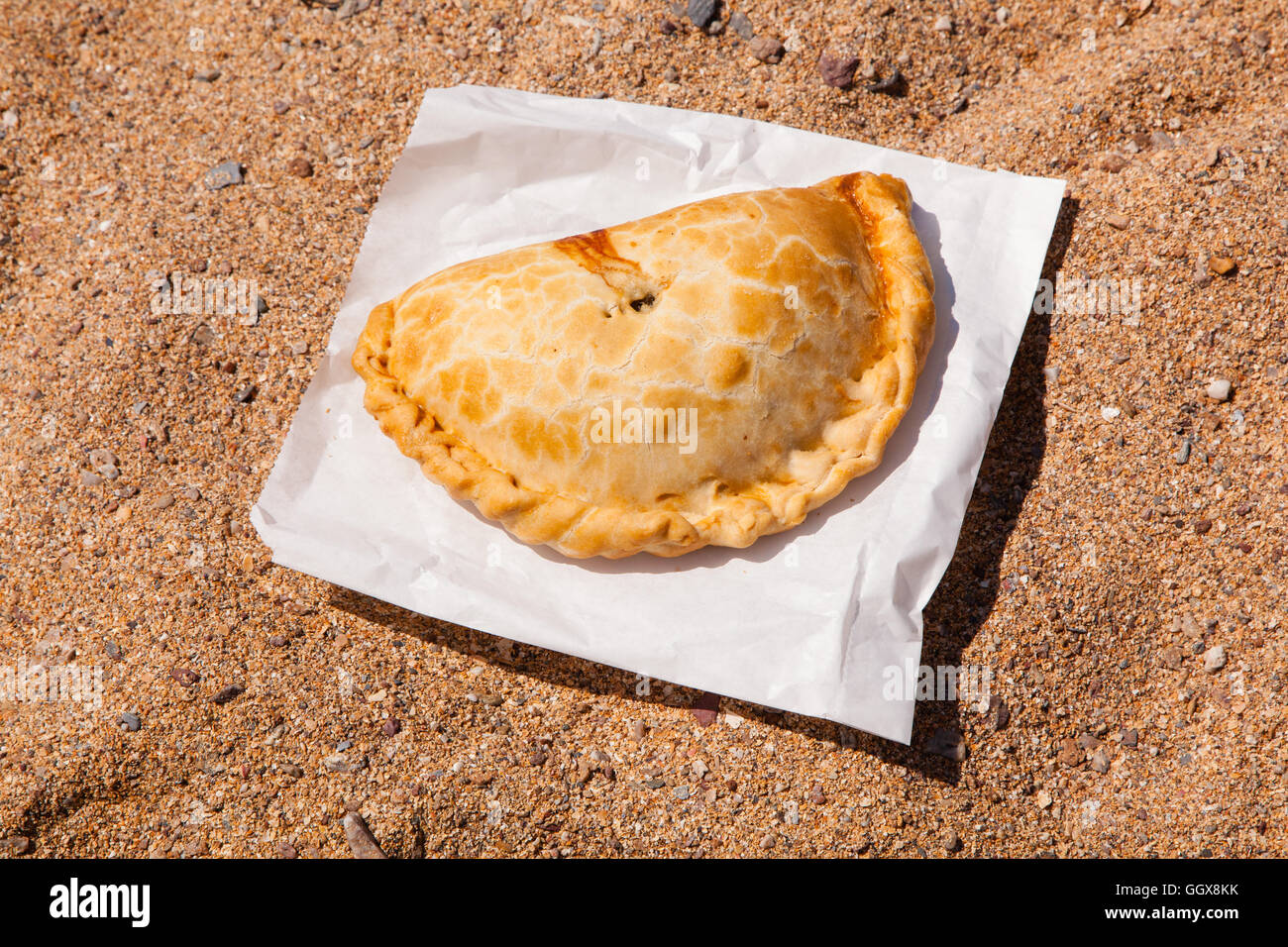 Cornish pasty on the beach, Devon England, United Kingdom. Stock Photo