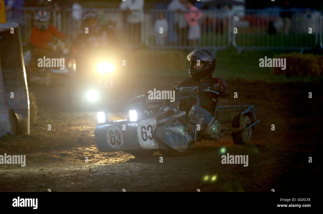 Teams compete in the BLMRA 12 Hour Lawn Mower Race near Five Oaks, west Sussex. Stock Photo