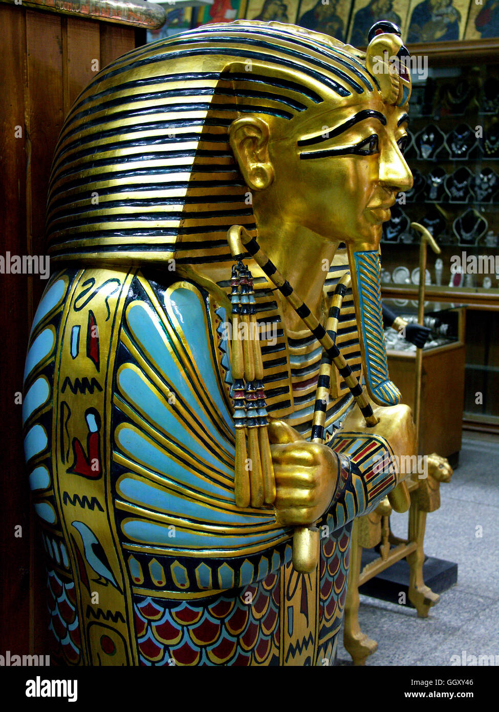 Store in the Coptic neighborhood of Cairo selling furniture modeled after ancient Egyptian artifacts. Mummy case of Tutankhamon. Stock Photo