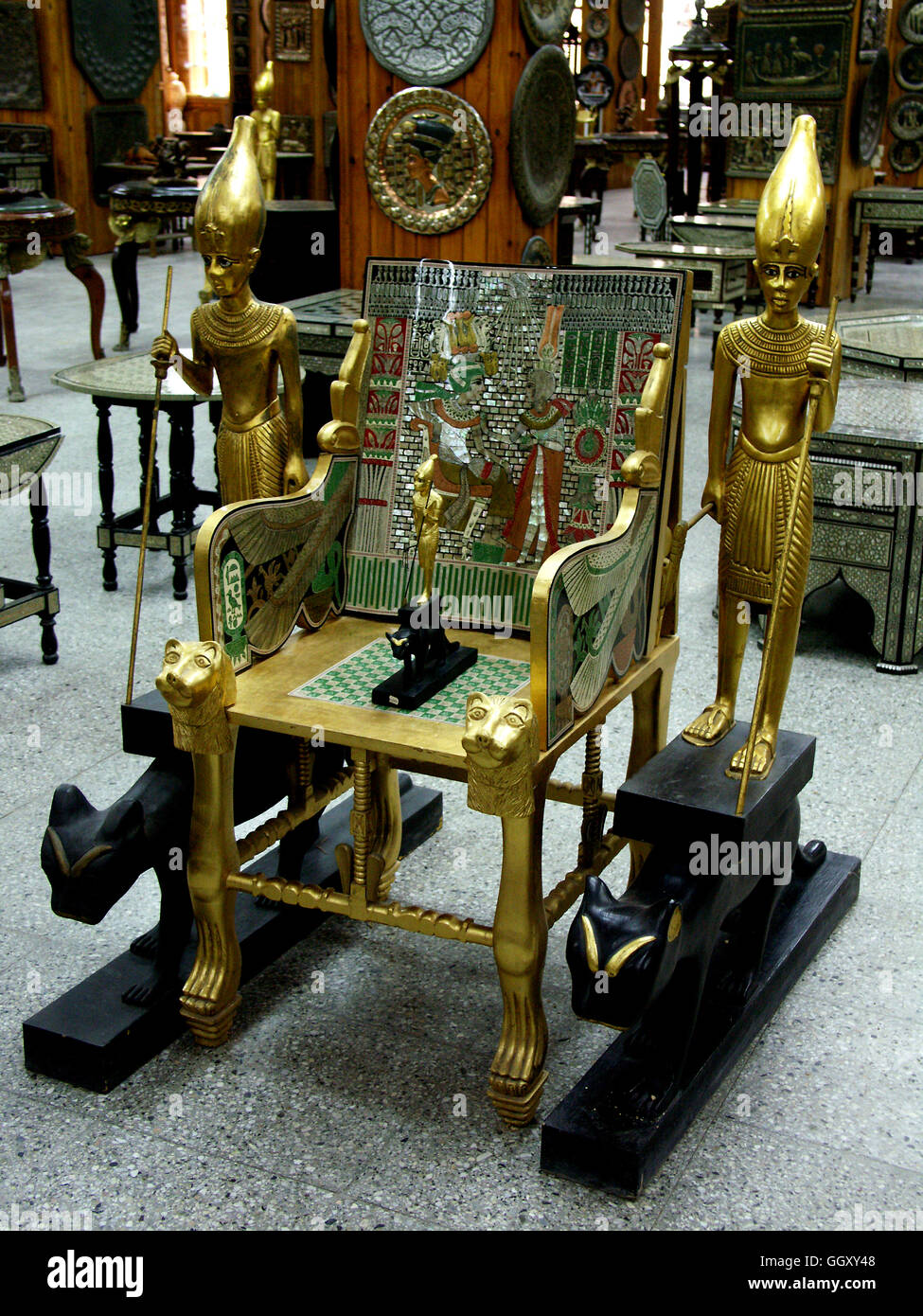 Store in the Coptic neighborhood of Cairo selling furniture modeled after ancient Egyptian artifacts. Mummy case of Tutankhamon. Stock Photo