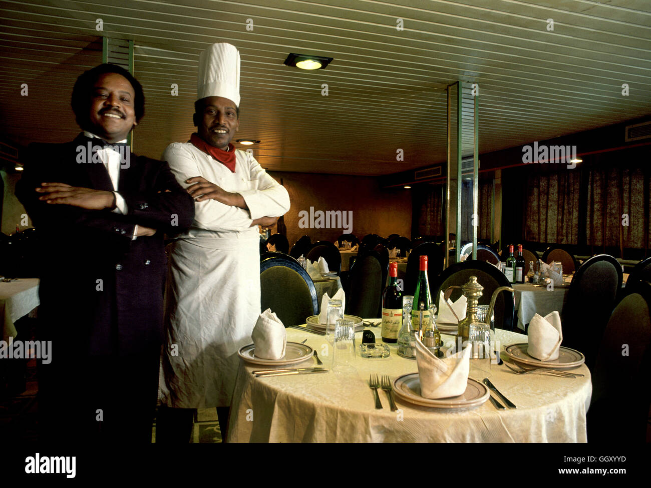 Chef and maitre’d in the dining room of a Nile Cruise boat near Luxor – Egypt. Stock Photo