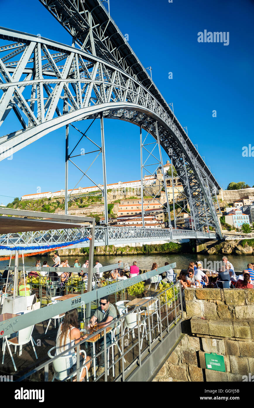 outdoor terrace bar cafe and landmark bridge in ribeira riverside area ...