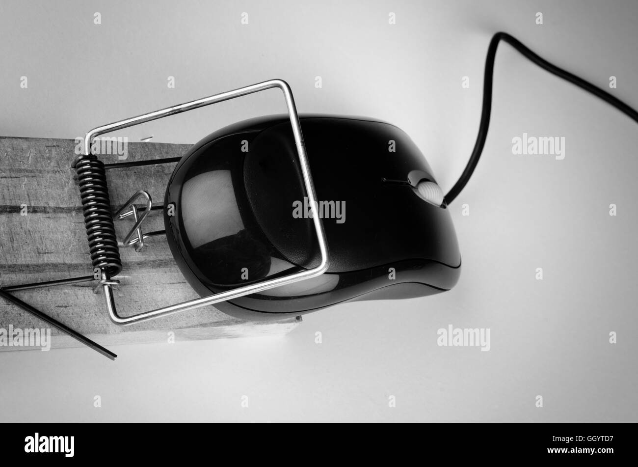 Computer mouse in a trap, a e commerce and computer addiction concept