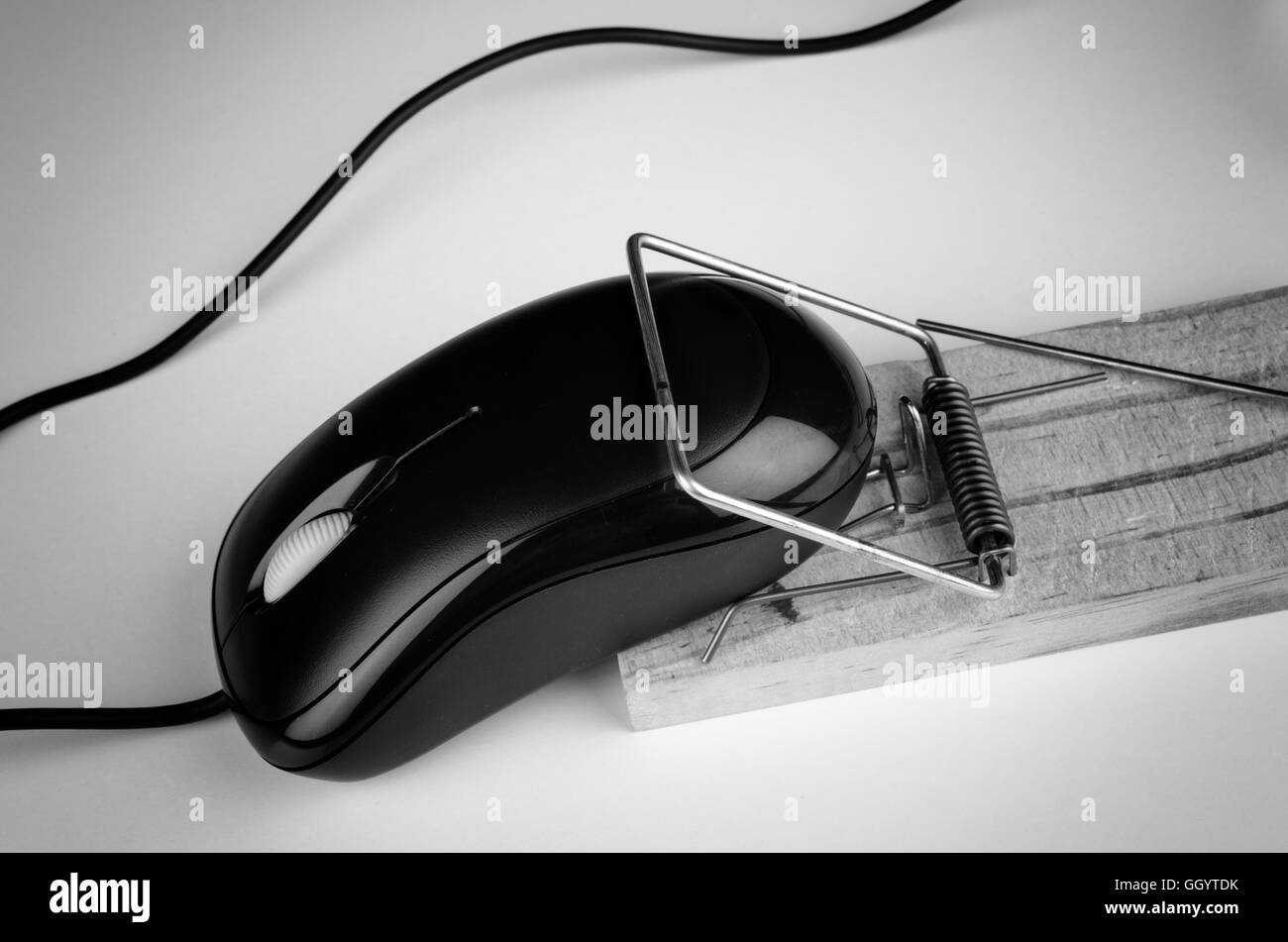 Computer mouse in a trap, a e commerce and computer addiction concept