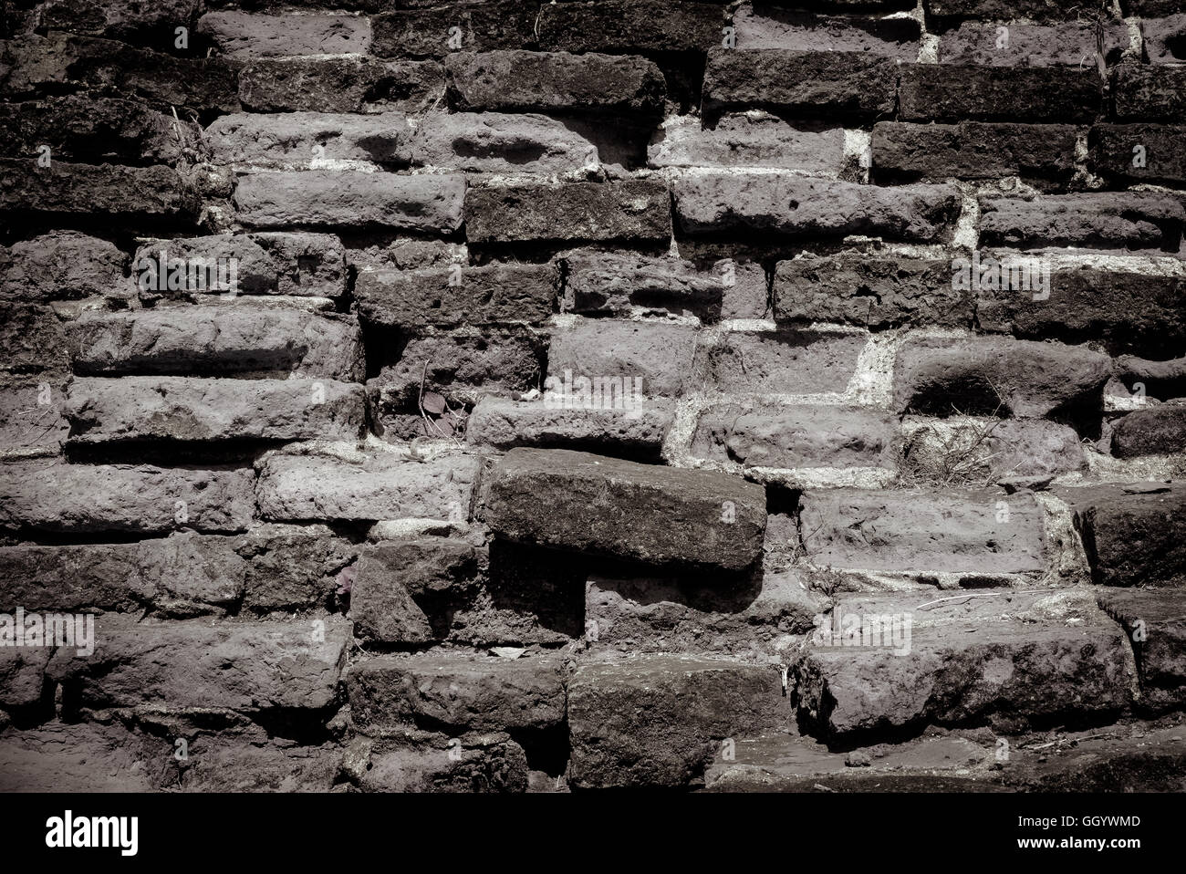 Weathered texture of stained old dark brick wall background Stock Photo ...