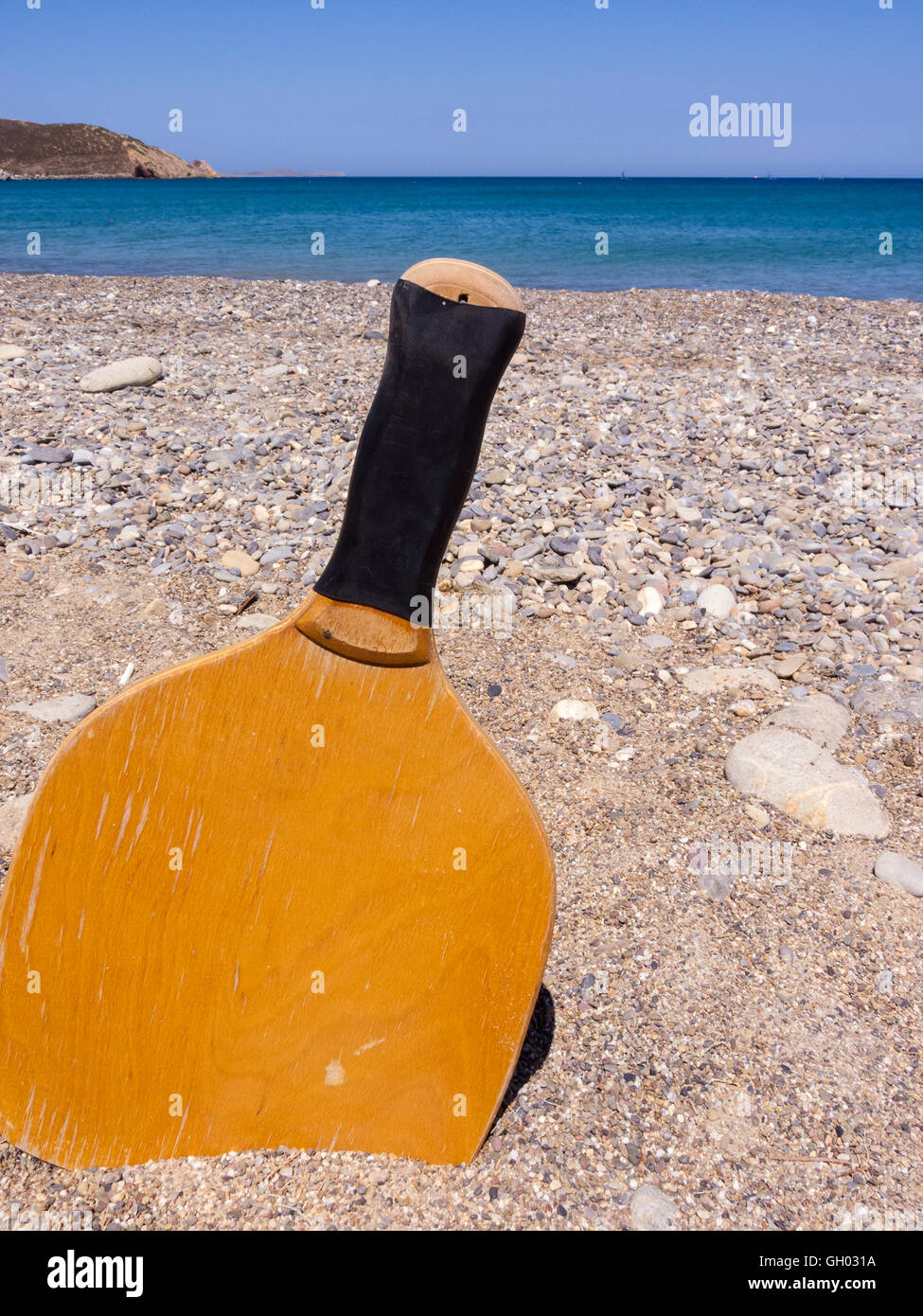 Racket in the sand of the beach in a sunny day. Summertime. Crete ...