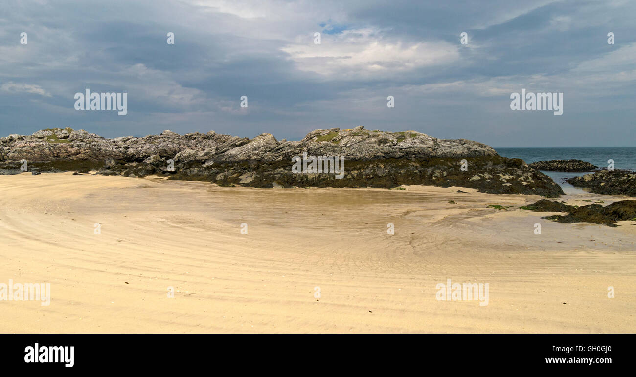 Sands of Balnahard Beach with dark grey cloudy sky, Isle of Colonsay, Scotland, UK. Stock Photo
