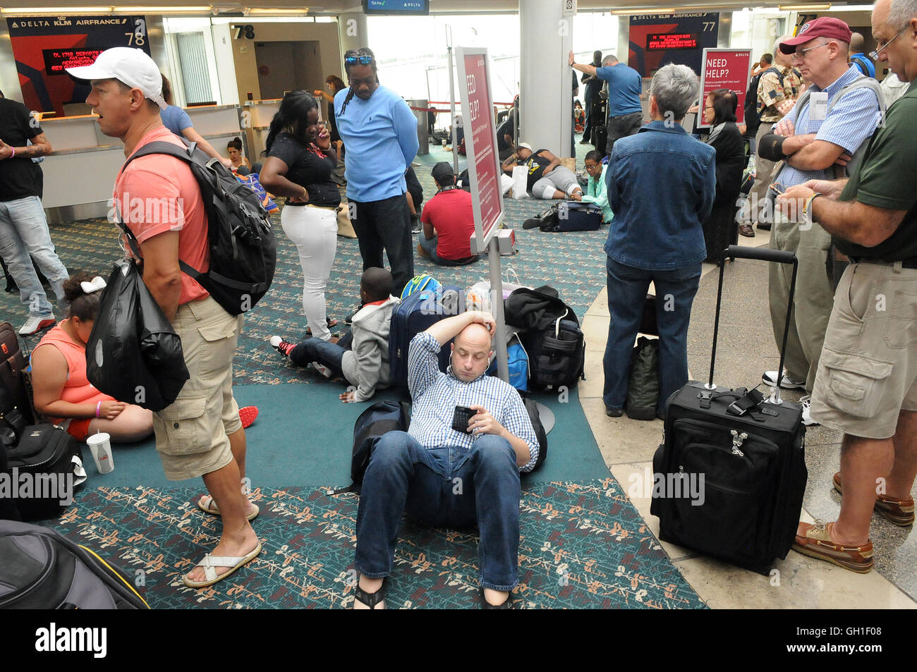 Orlando, Florida, USA. 8th August, 2016.  Delta Airlines passengers wait at Orlando International Airport as all flights worldwide were grounded early this morning due to a computer system shutdown. Credit:  Paul Hennessy/Alamy Live News Stock Photo