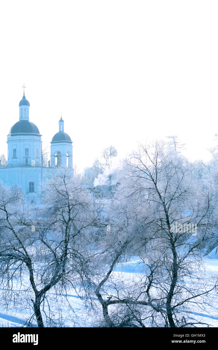 Winter landscape with frozen trees and Russian Orthodox Church Stock Photo