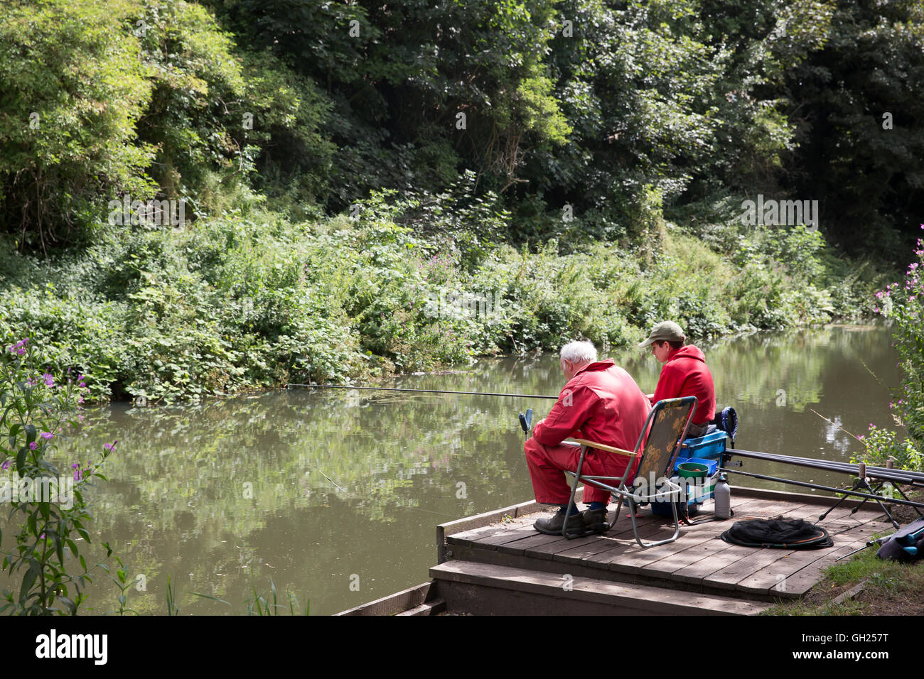 A young boy and his grandfather fishing on The Chesterfield Canal in