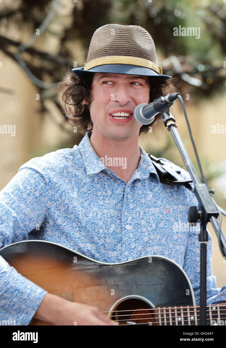 Jonny Walker sings during a protest against new local council Public Space Protection Orders (PSPO), in Gillett Square Dalston, London. Stock Photo